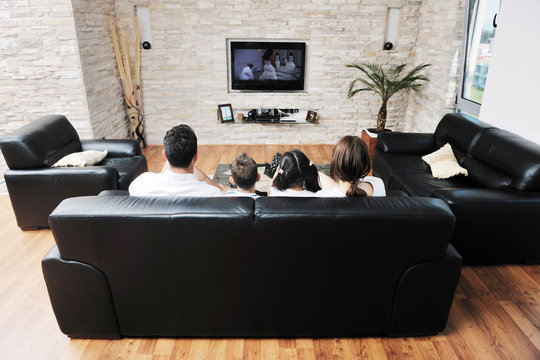 Family Wathching Flat Tv At Modern Home Indoor