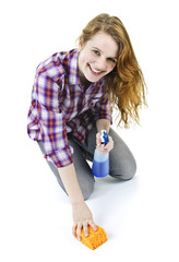 Young woman washing floor