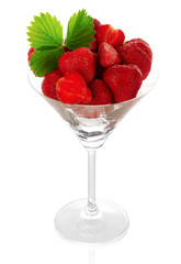 Many strawberries in glass isolated on white