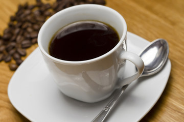 black coffee cup on wooden table