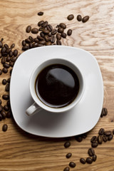 black coffee cup on wooden table