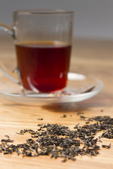 cup of black tea on wooden table