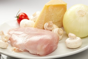 Fresh raw chicken fillets with vegetables