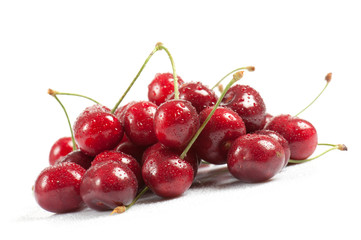 Obraz na płótnie Canvas wet cherries on white background