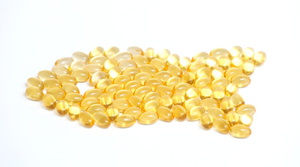 fish oil pills arranged as fish shape