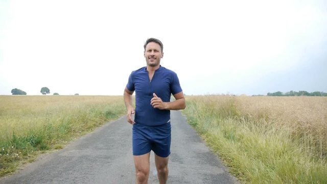Man jogging on country road