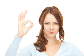 lovely teenage girl showing ok sign