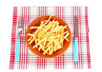 French fries on a plate and cutlery isolated on white