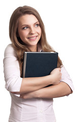 Attractive woman smiling while holding book