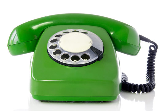 green retro telephone isolated on white background.
