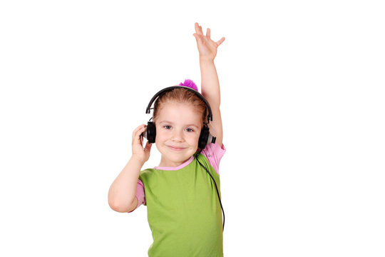 little girl with headphones enjoy in music