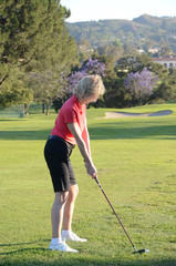 Mature Woman Playing Golf