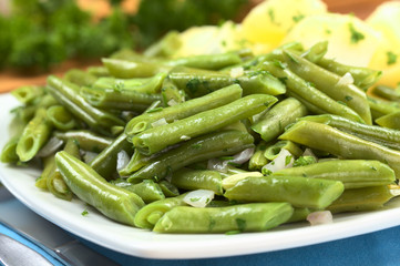 Cooked green beans with onion, parsley and potatoes