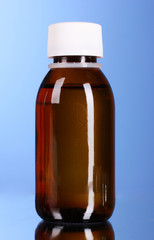 medicine in a bottle with a blue background