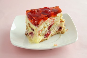 homemade fruit-cake with jelly,mass,bisquits and strawberries