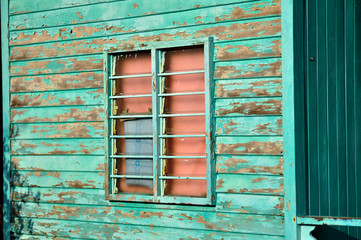 Fototapeta na wymiar wooden house with peel paints