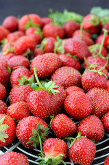 Organic strawberries on  a dark background