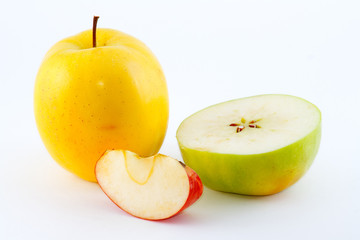 The red, yellow and green juicy fresh apples and slices