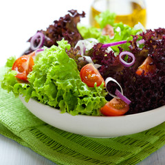 Summer salad with green and red lettuce leaves