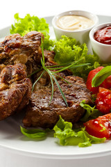 Grilled steaks and vegetables