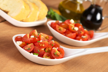 Cherry tomato wedges with cheese and chives