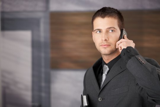 Handsome businessman on phone