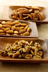 Assortment of nuts in wooden containers