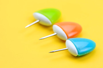 Three push pins