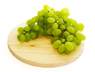 grape bunch on wooden plate