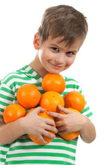 Fototapeta na wymiar Boy holding oranges