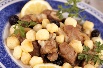 Cooked meat with potatoes