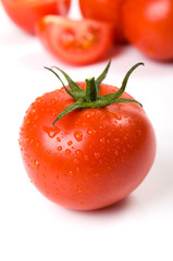 Tomato with water drops close-up