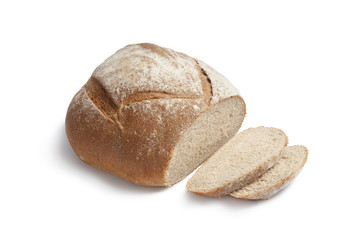 Whole fresh artisanloaf of bread and slices