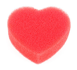 Sponge for shower in form of big red heart isolated on white