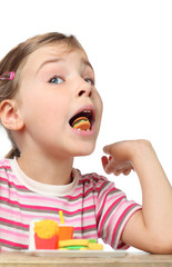 little girl eating toy burger, toy cola and hamburger