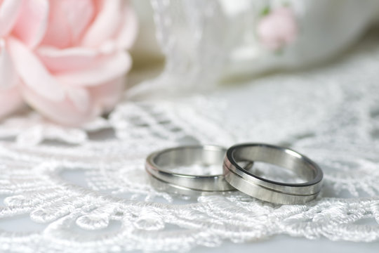 Wedding rings on romantic background