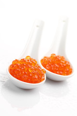 Salmon caviar in spoons