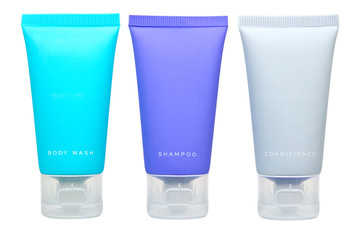 Body lotion, shampoo and conditioner in tubes isolated on white