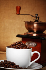 dark coffee still life with retro grinder