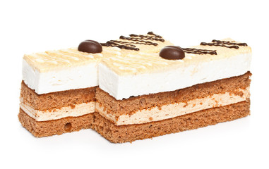 Slice of cappuccino cake isolated on white