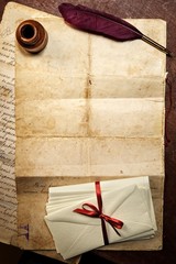 Quill, inkwell and old paper.