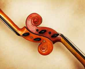 two old violin scrolls detail in ambient light
