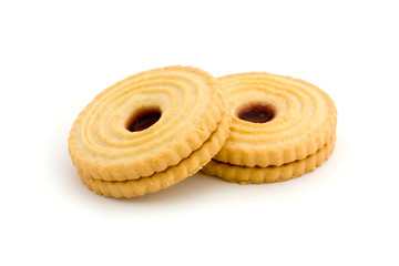 Two jam filled biscuits over white