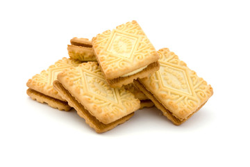 Pile of cream filled biscuits over white