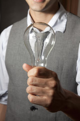 Man holding light bulb