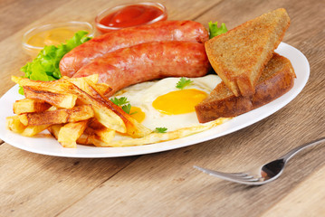 Fried eggs with sausages