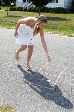 Woman Playing Hopscotch