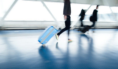 Airport rush: people with their suitcases
