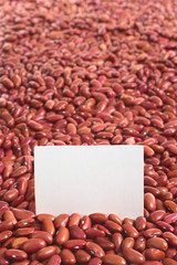 Raw red kidney beans with blank card