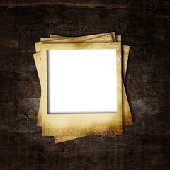 Old photo frame on wooden background